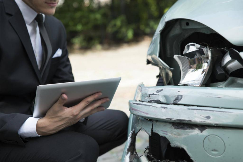 St. Louis insurance adjuster inspecting damage