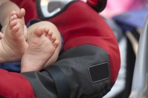 child feet in a car seat