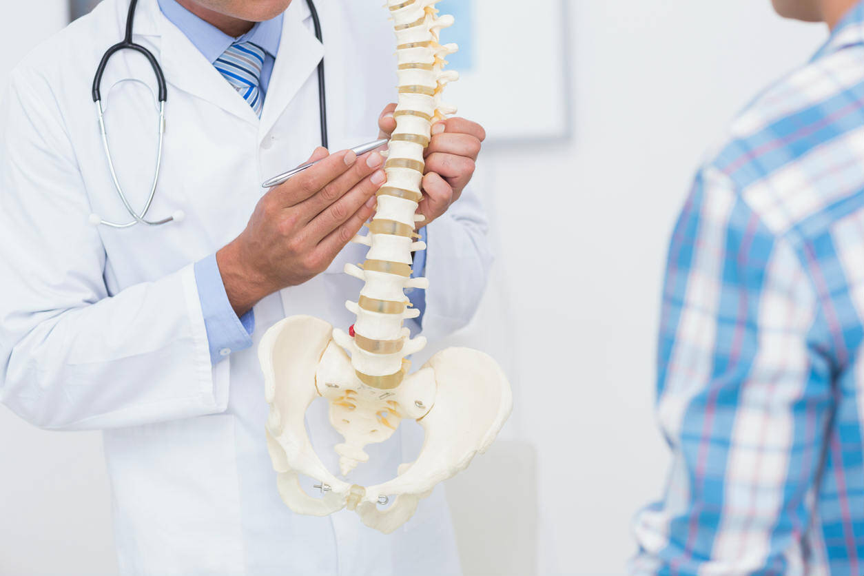 doctor explaining spine treatment