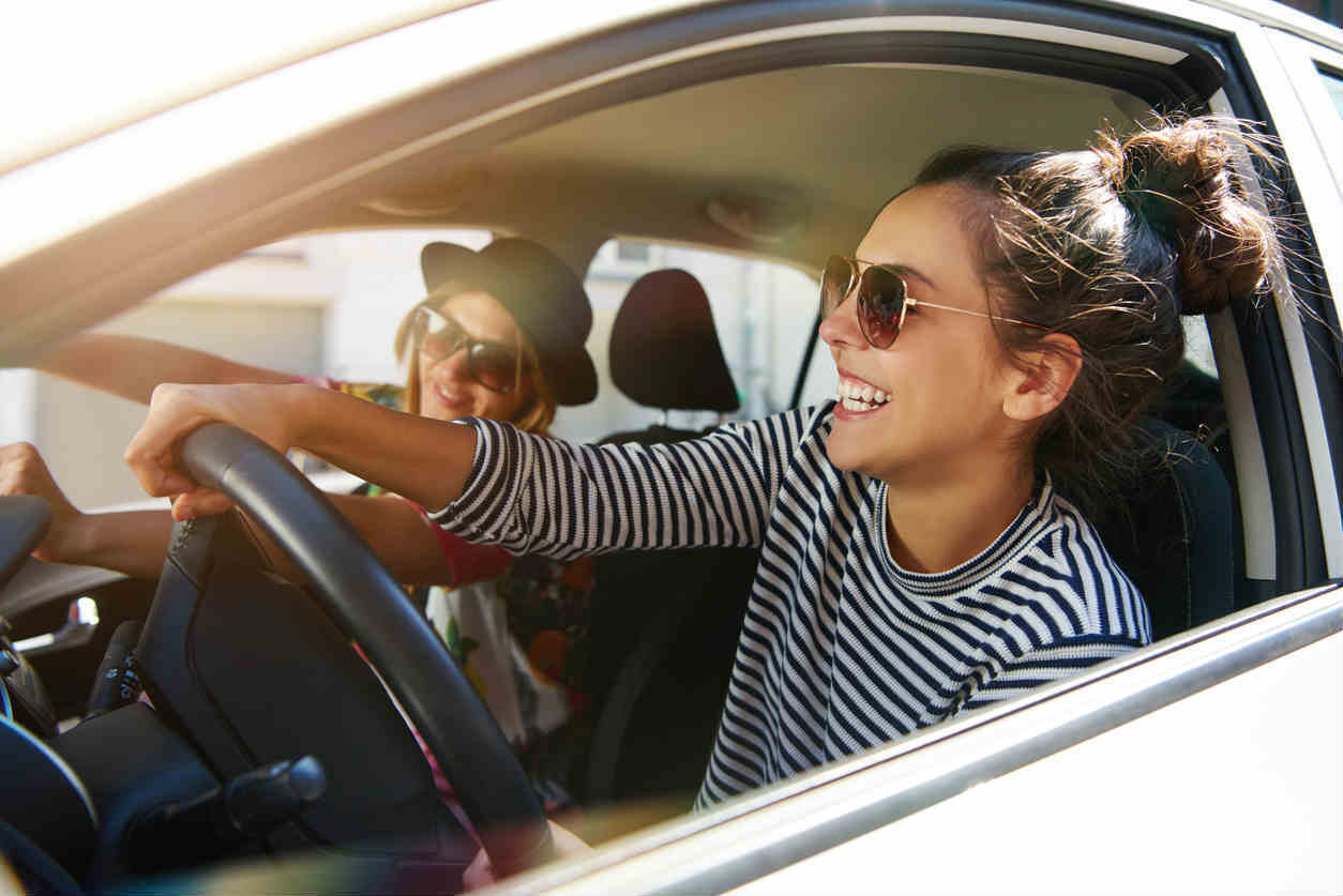 women driving during the summer