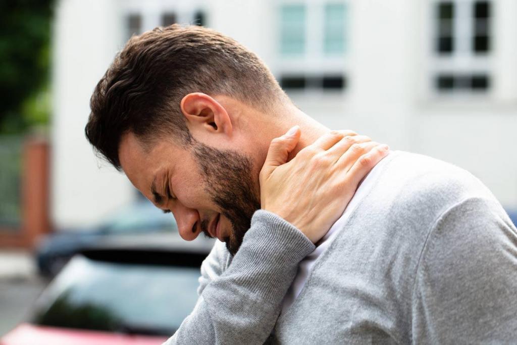 man with neck pain after a car accident