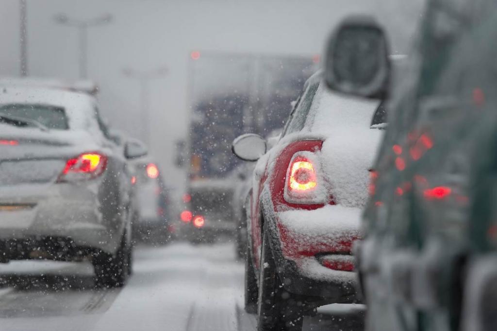 multiple cars driving in snow