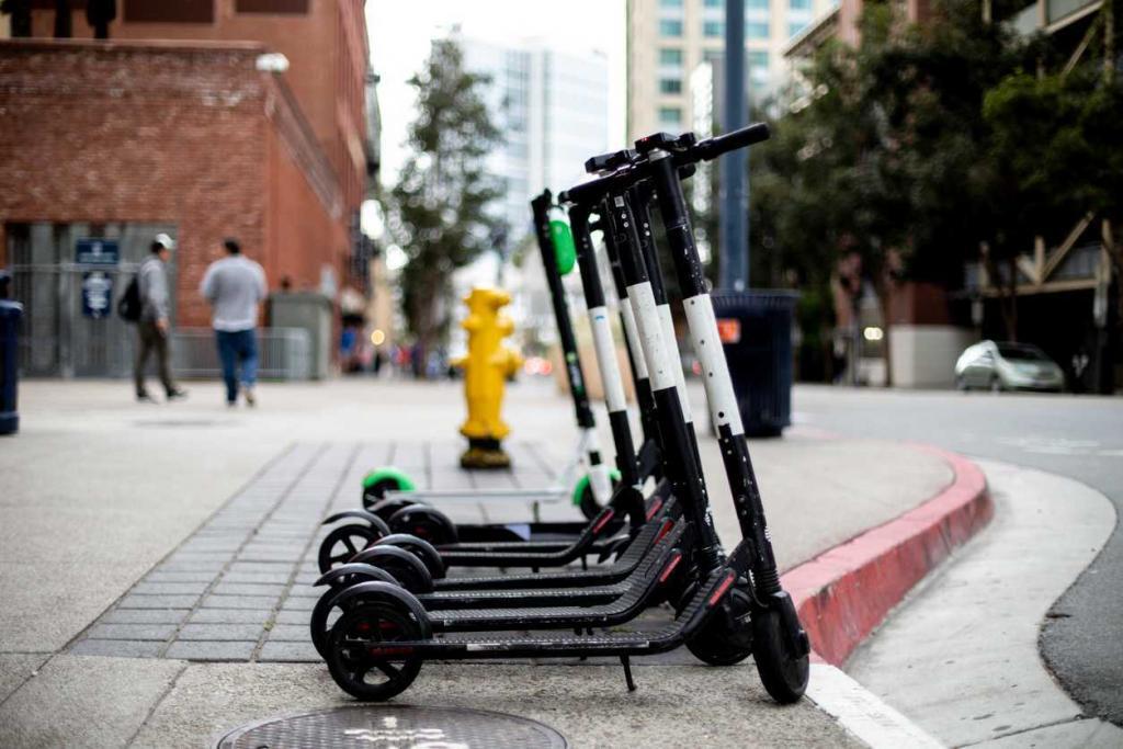 electric scooters on the sidewalk