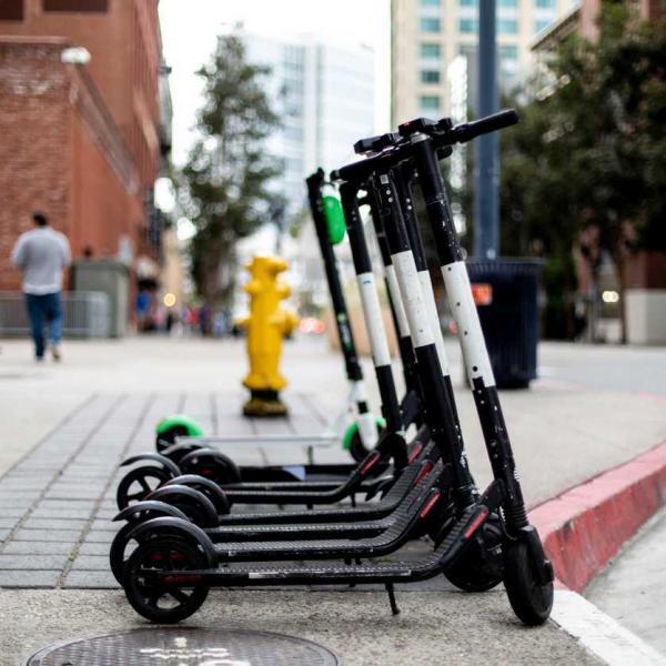 electric scooters on the sidewalk