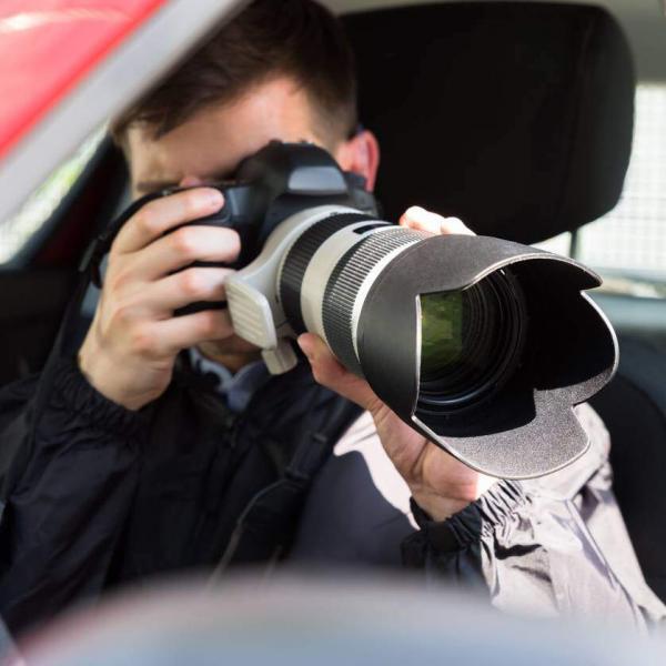 private investigator taking pictures after car accident