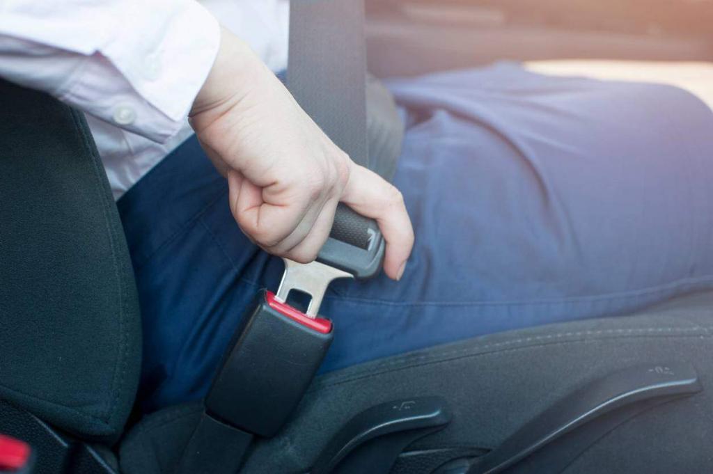 st. louis woman buckling seatbelt