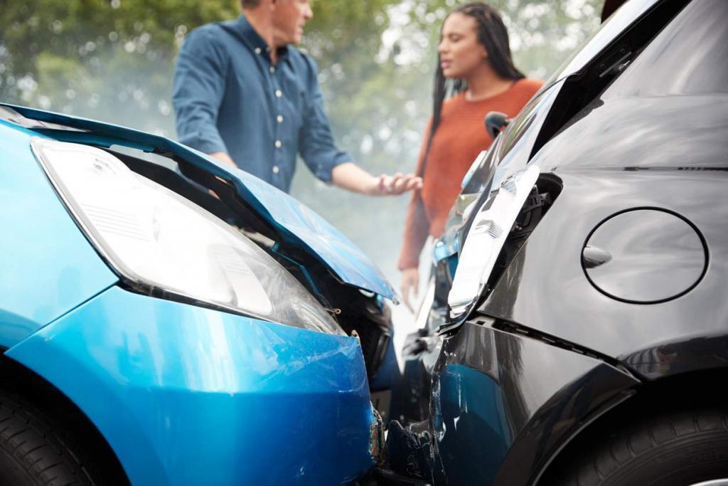 two drivers talking after a car crash