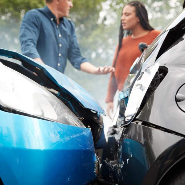 two drivers talking after a car crash