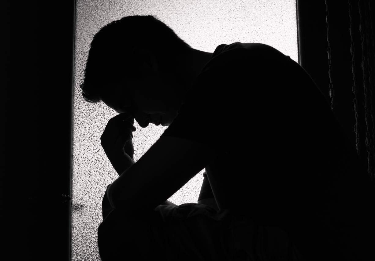 man with survivor guilt
