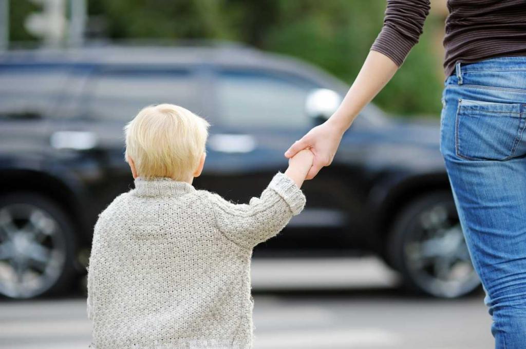 st. louis child crossing the street holding his mom's hand