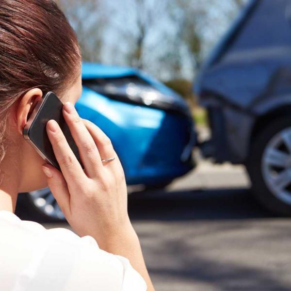 woman on phone after a car accident