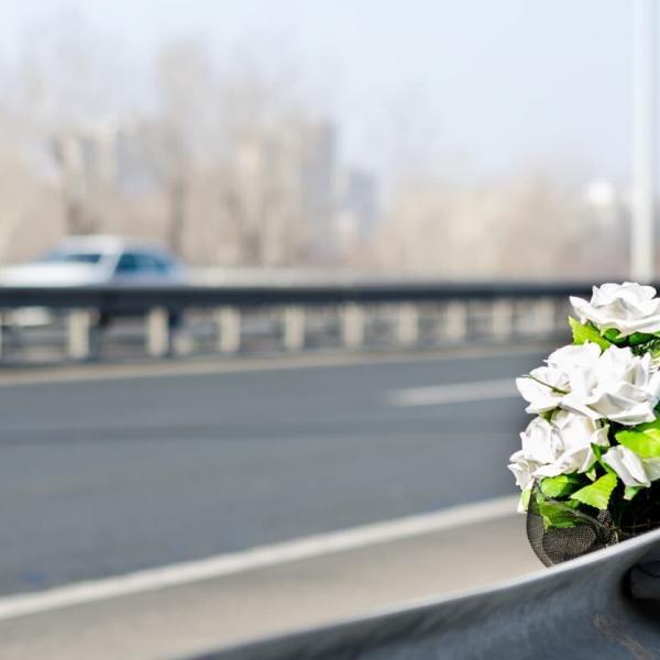 flowers at the scene of a fatal car accident