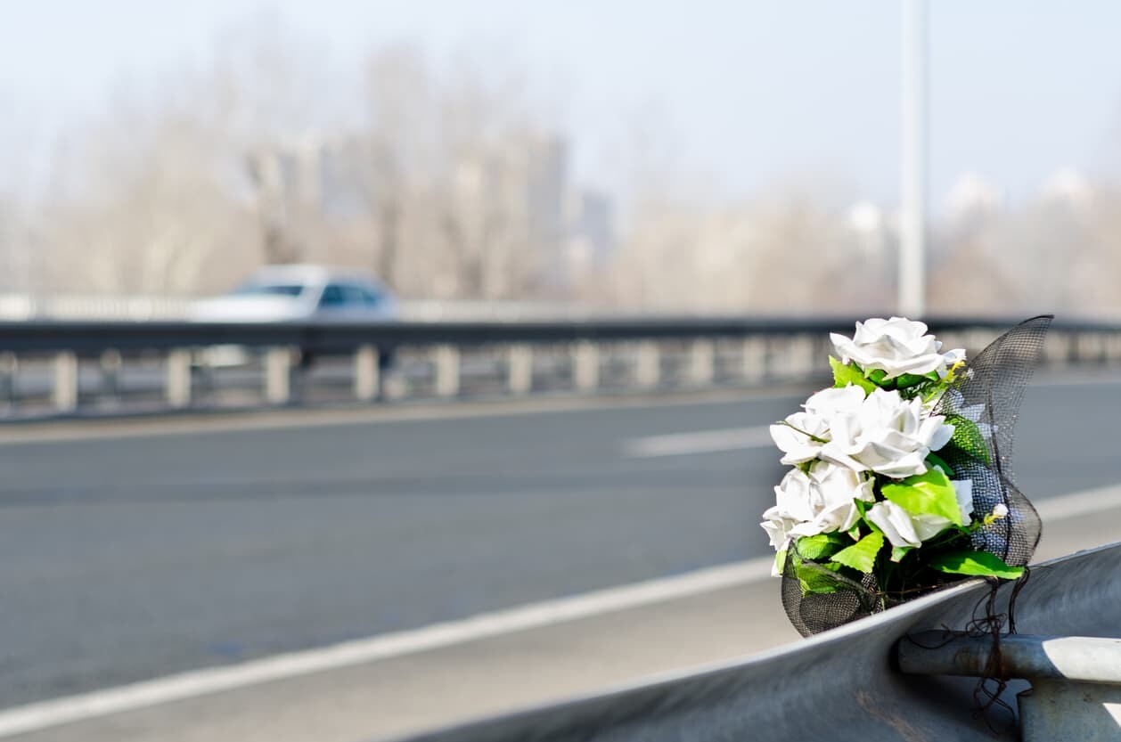 flowers at the scene of a fatal car accident