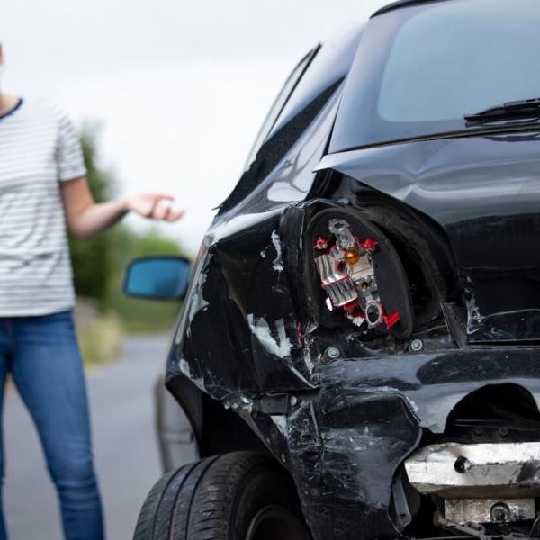 woman on the phone after a miss and run accident