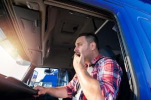 fatigued truck driver yawning
