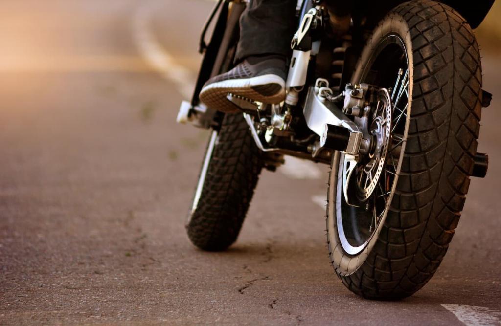 st. louis motorcycle rider about to make a left hand turn