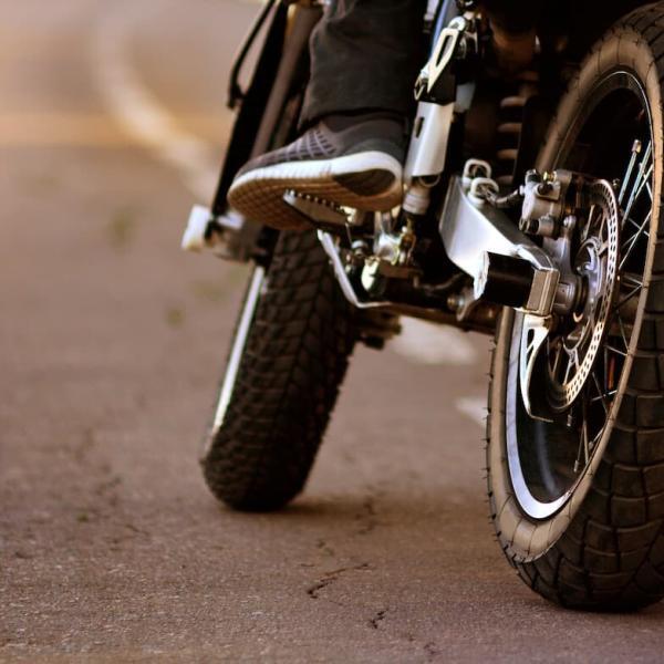 st. louis motorcycle rider about to make a left hand turn