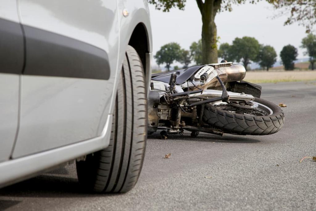 motorycle that has been hit by a car