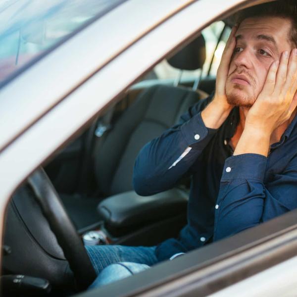 young man stuck in traffic