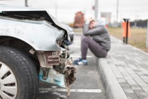 damaged car and injury victim
