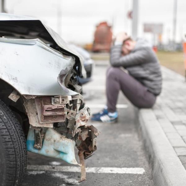 damaged car and injury victim