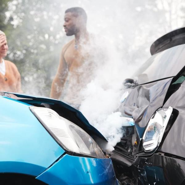 a man and a woman talking after a car accident