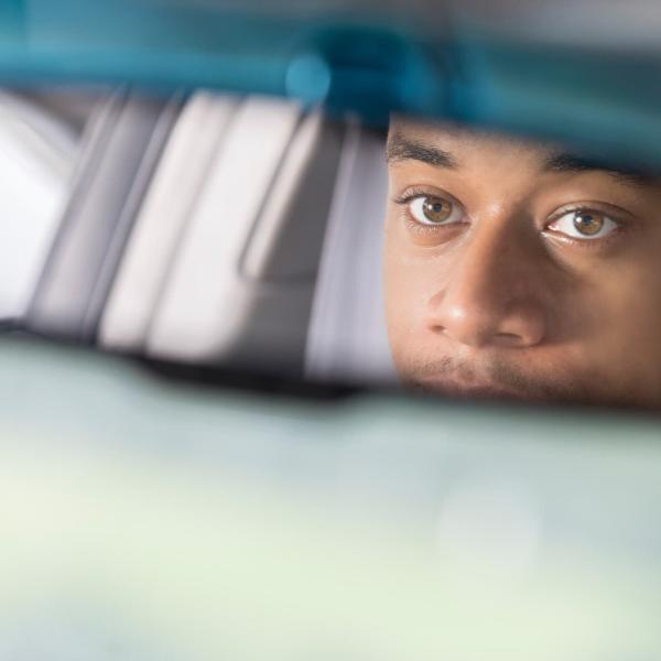 driver looking in rearview mirror