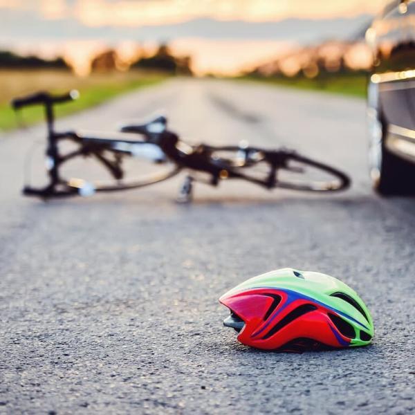 bike on the ground after a bike and car accident