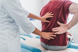 a patient with back pain after a car accident