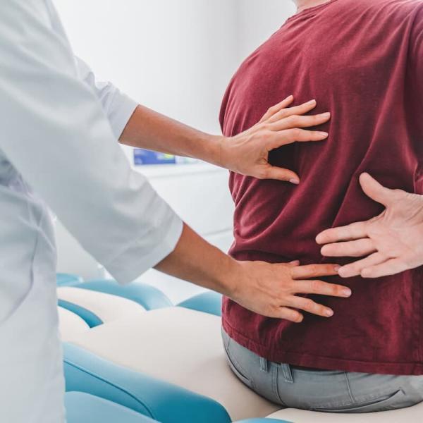 a patient with back pain after a car accident