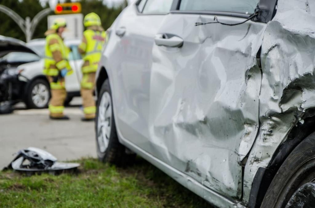 firemen at the scene of a car accident