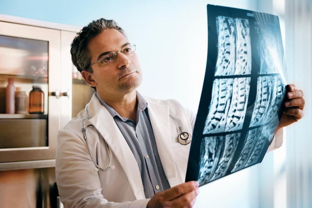 doctor looking at mri of spinal cord