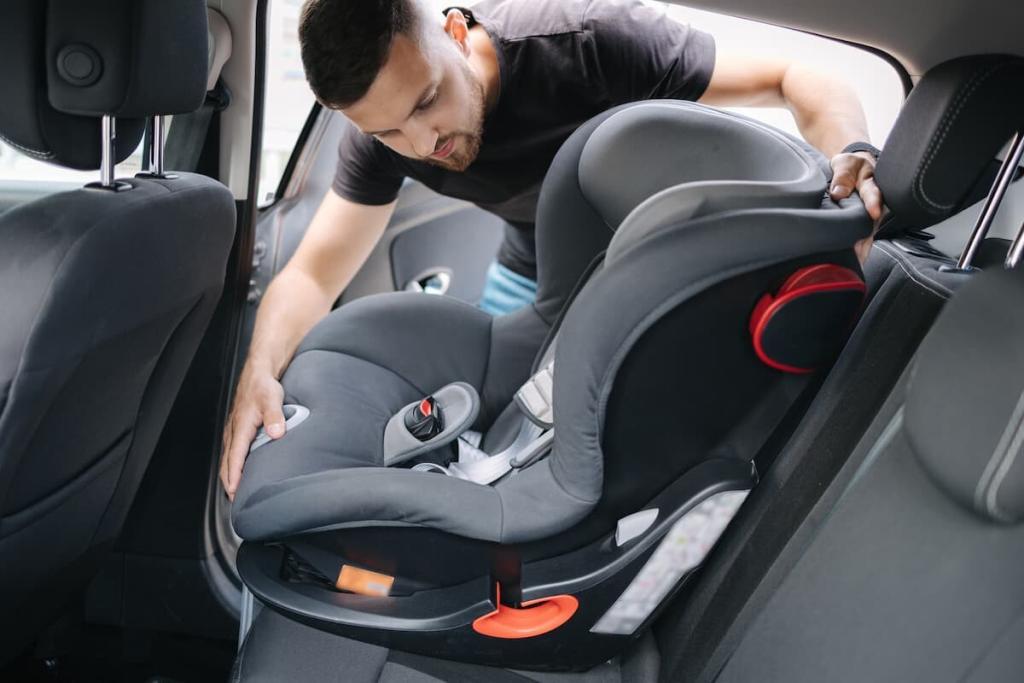 father installing a car seat