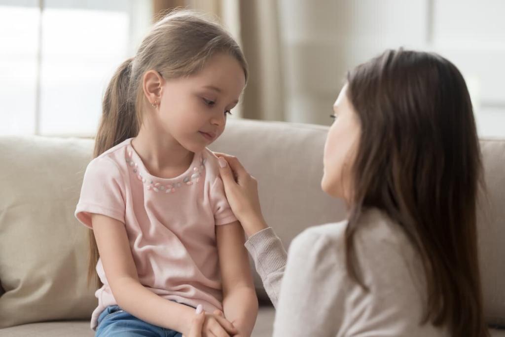 mother talking to scared child after a car accident