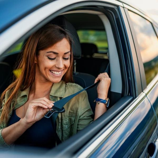 st. louis driver putting on her seat belt