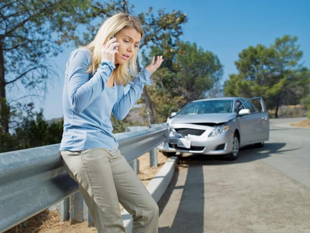 woman who has crashed into guard rail