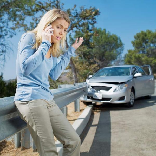 woman who has crashed into guard rail