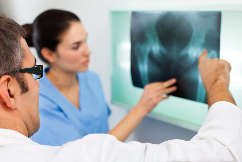 doctors examining a pelvic x-ray