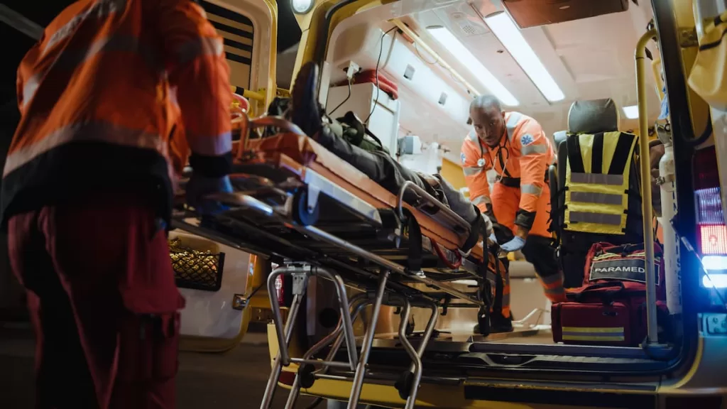 injured accident victim being put in the back of an ambulance