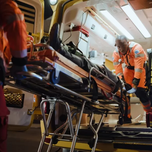 injured accident victim being put in the back of an ambulance