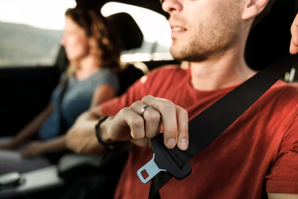 st. louis driver putting on their seat belt