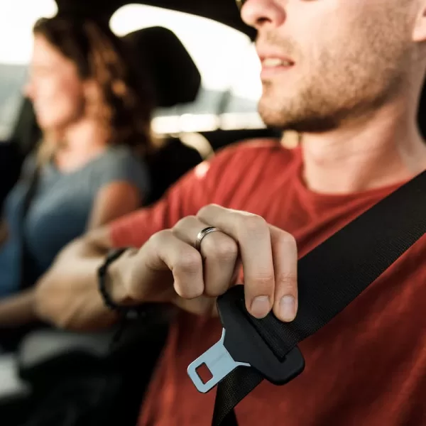 st. louis driver putting on their seat belt