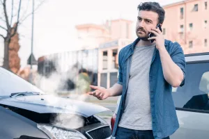 man calling a lawyer after an uninsured motorist accident in Missouri