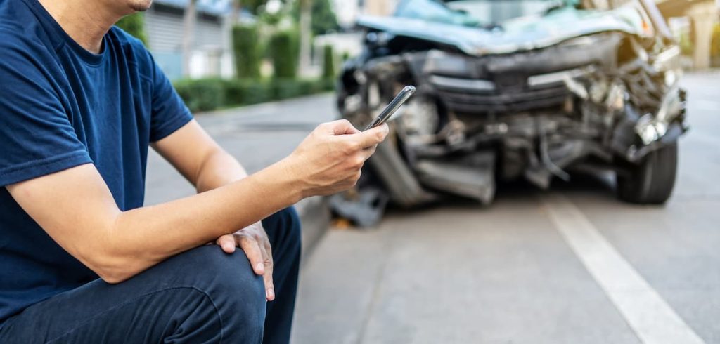 man calling an auto accident attorney after a ballwin car accident
