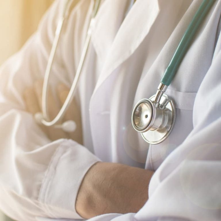 car injury specialist wearing a stethoscope