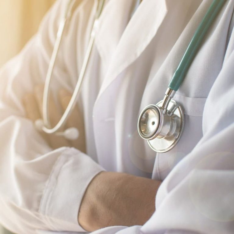 car injury specialist wearing a stethoscope