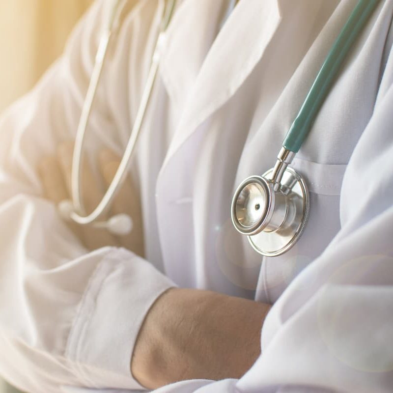 car injury specialist wearing a stethoscope